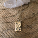 Tarot card necklace featuring the magician